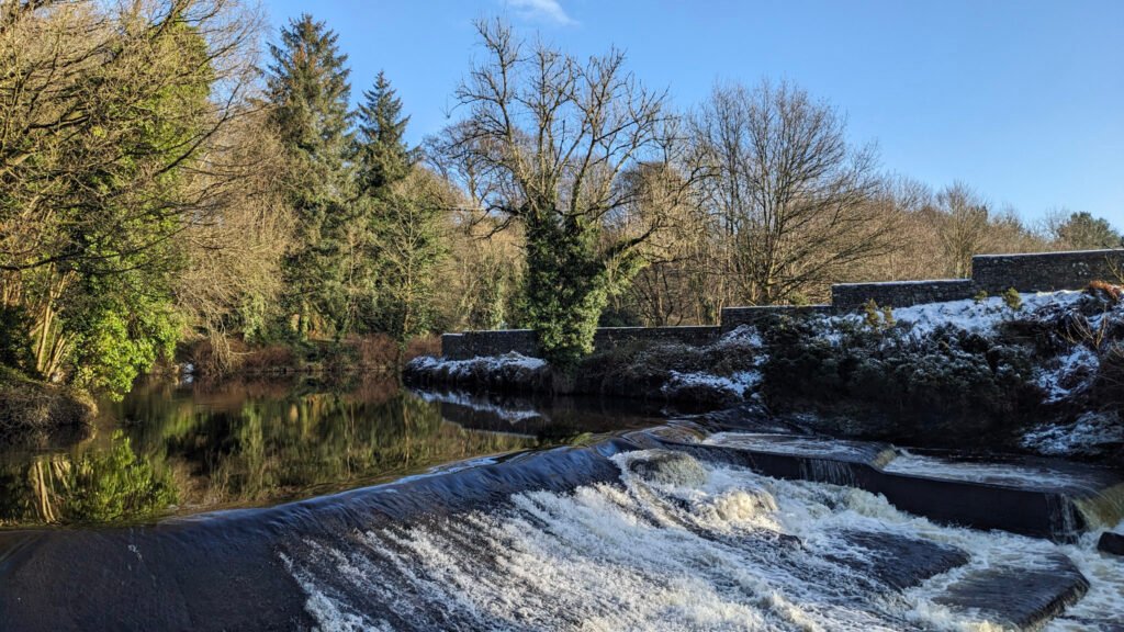 Lovers Retreat waterfall with the snow thawed from the trees in the afternoon sun