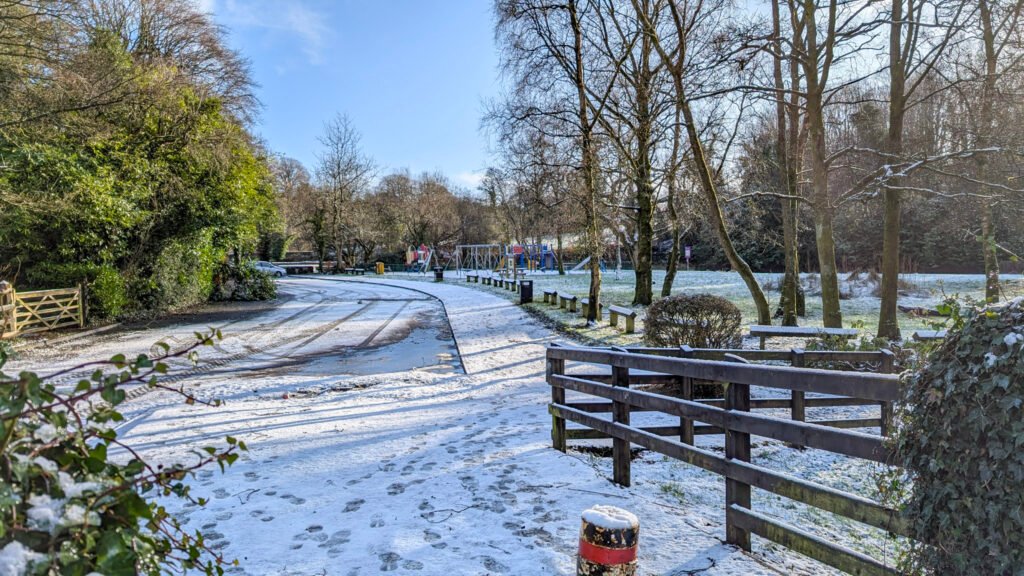 A view of the park in the snow from the footbridge at Lover's Retreat Omagh