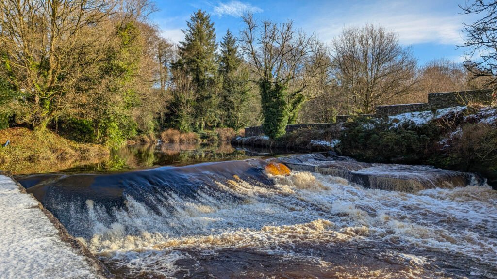 Waterfall at Lover's Retreat with a dusting of snow day after Storm Eowyn in Omagh