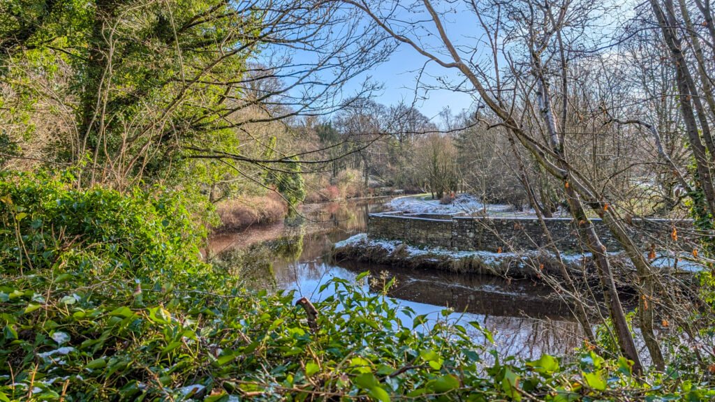 View of river at Lover's Retreat with a dusting of snow day after Storm Eowyn in Omagh