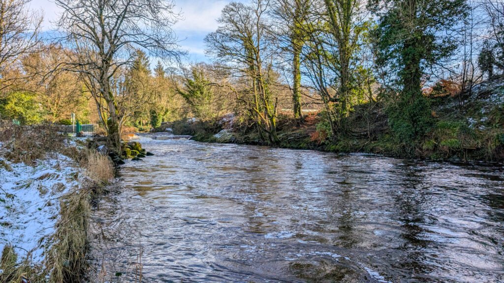 Mid river at Lover's Retreat looking east in the snow in Omagh