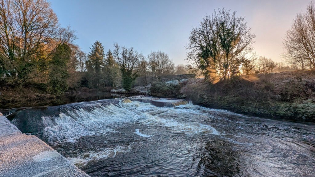 Frosty sunrise view of waterfall at Lovers Retreat Omagh.