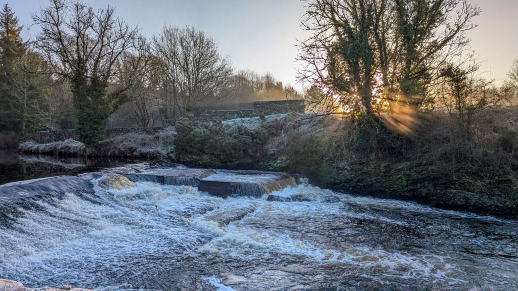 Frosty sunrise view of waterfall at Lovers Retreat Omagh.
