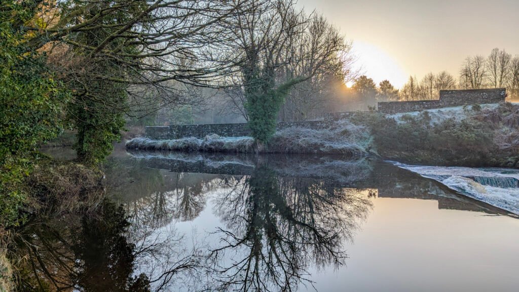 Frosty sunrise view of waterfall at Lovers Retreat Omagh.