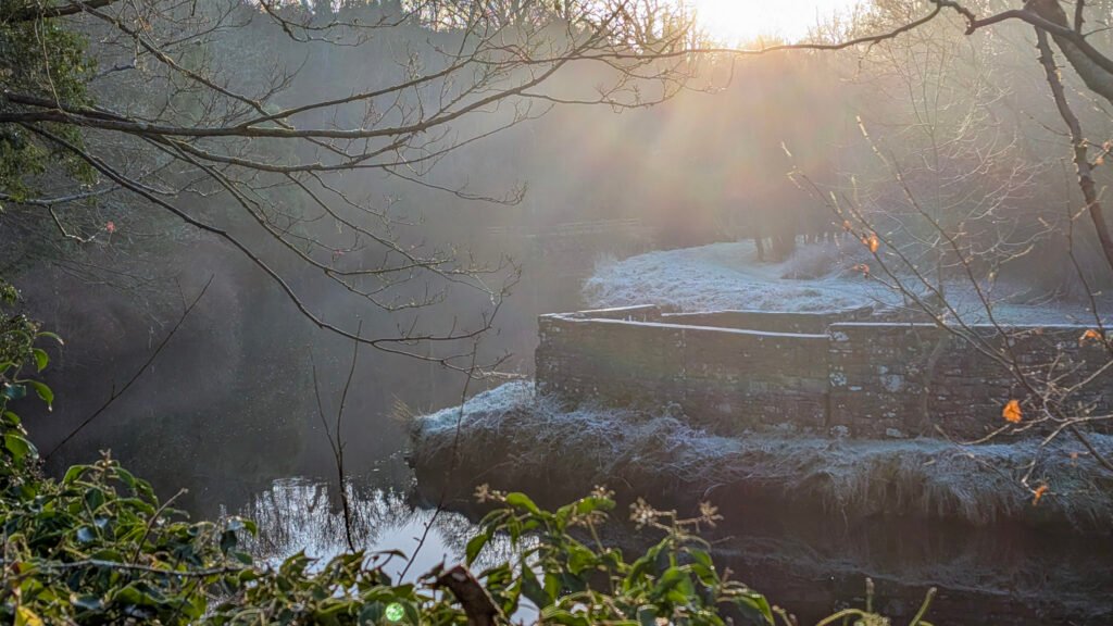Corner above the waterfall view of river at lovers retreat omagh. Frosty sunrise.